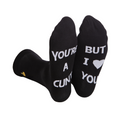 Black rude slogan socks with white text youre a cunt but i love you on the foot portion