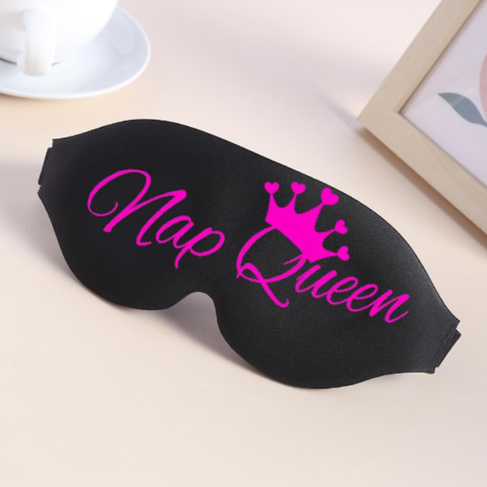 Black sleep mask made of soft fabric with vibrant pink nap queen text and crown design for funny restful naps