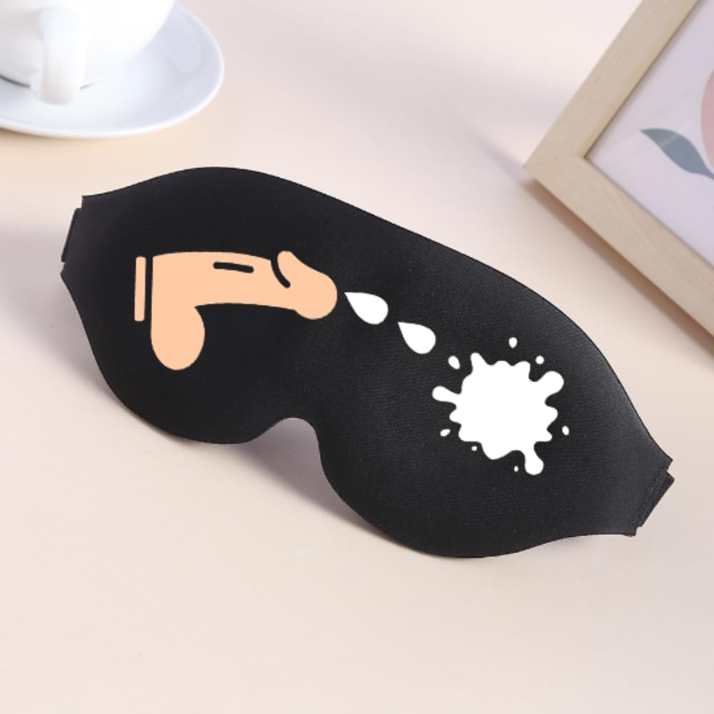 Black sleep mask featuring peach cartoon penis spraying white splatter design for funny sleep aid