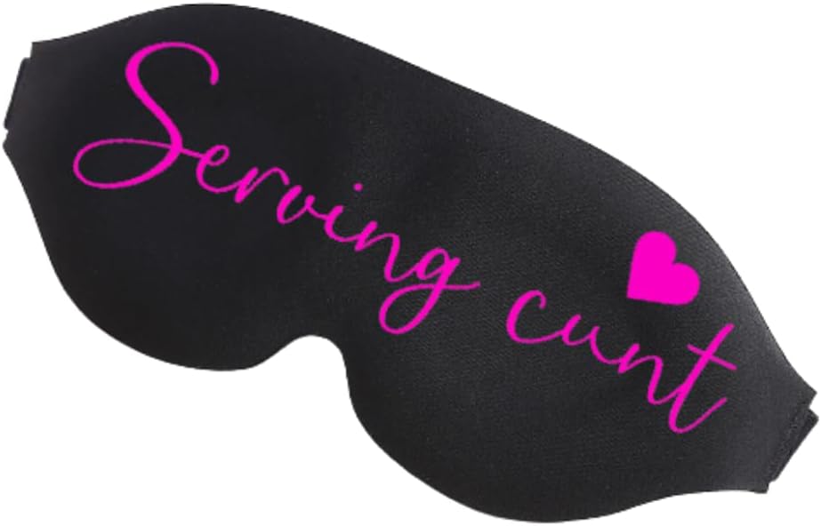 Black sleep mask with pink cursive text serving cunt and a small pink heart in a funny sleep mask design